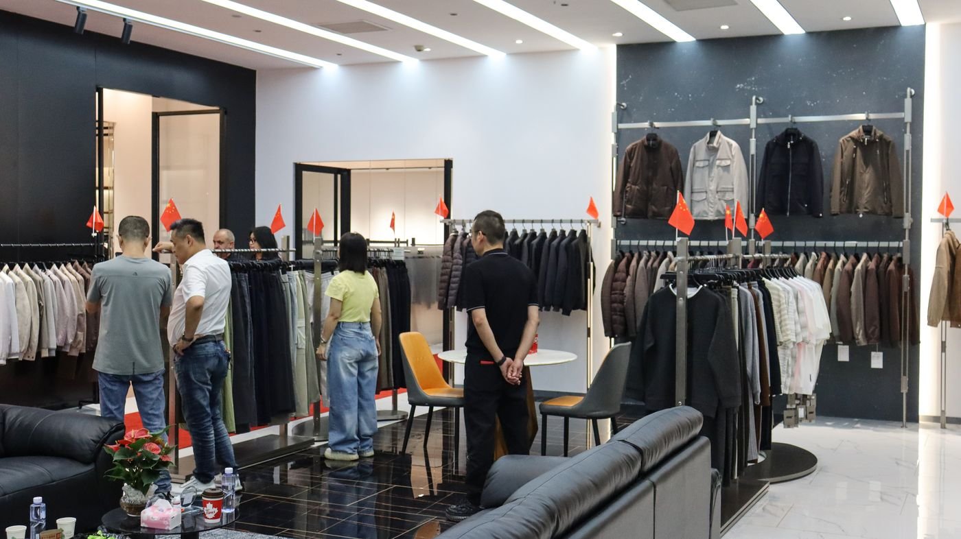 Buyers browsing men's jackets at the SAZ Atelier Guangzhou showroom